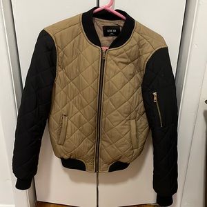 Tan and black bomber jacket